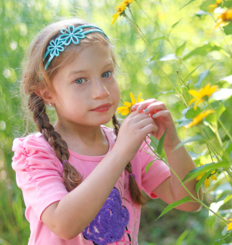 Girl smelling flowers